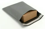 Grey Mailing containing a cardboard box